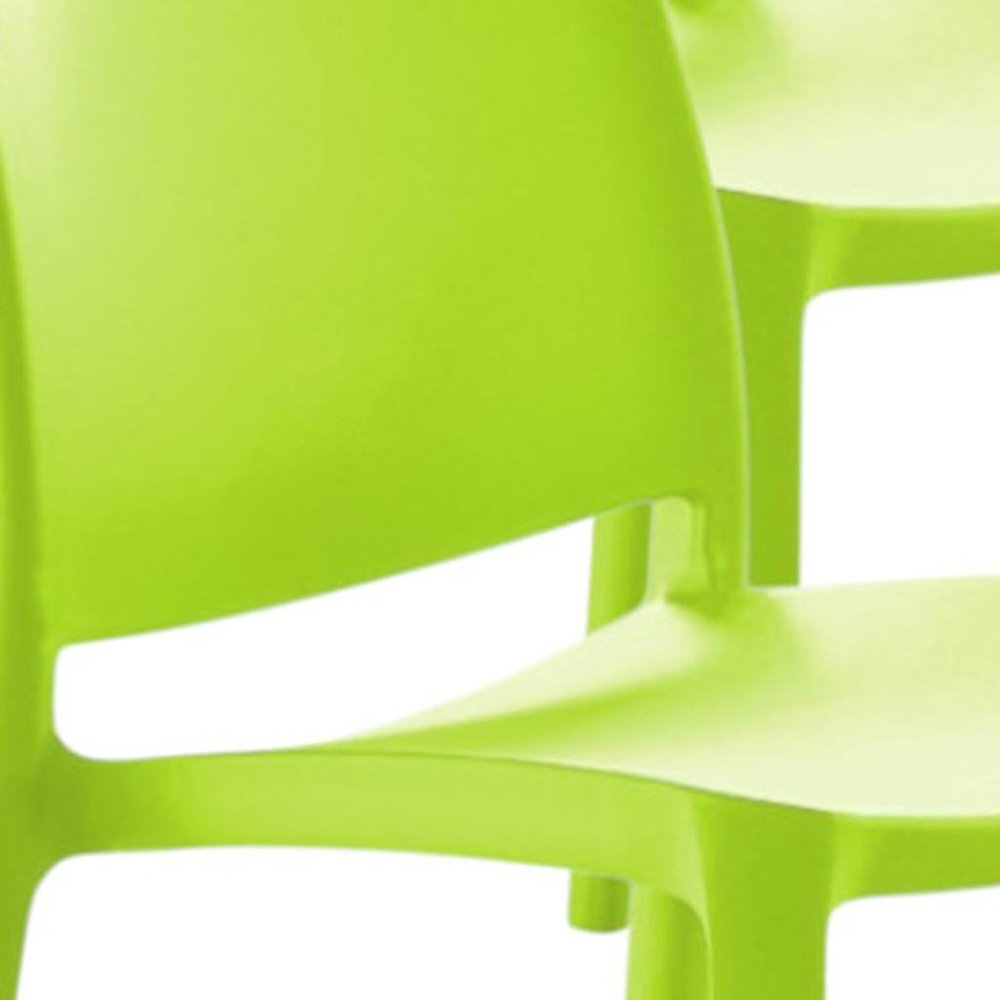 Set of Four Green Heavy Duty Plastic Outdoor Stacking Dining Chairs on a white background