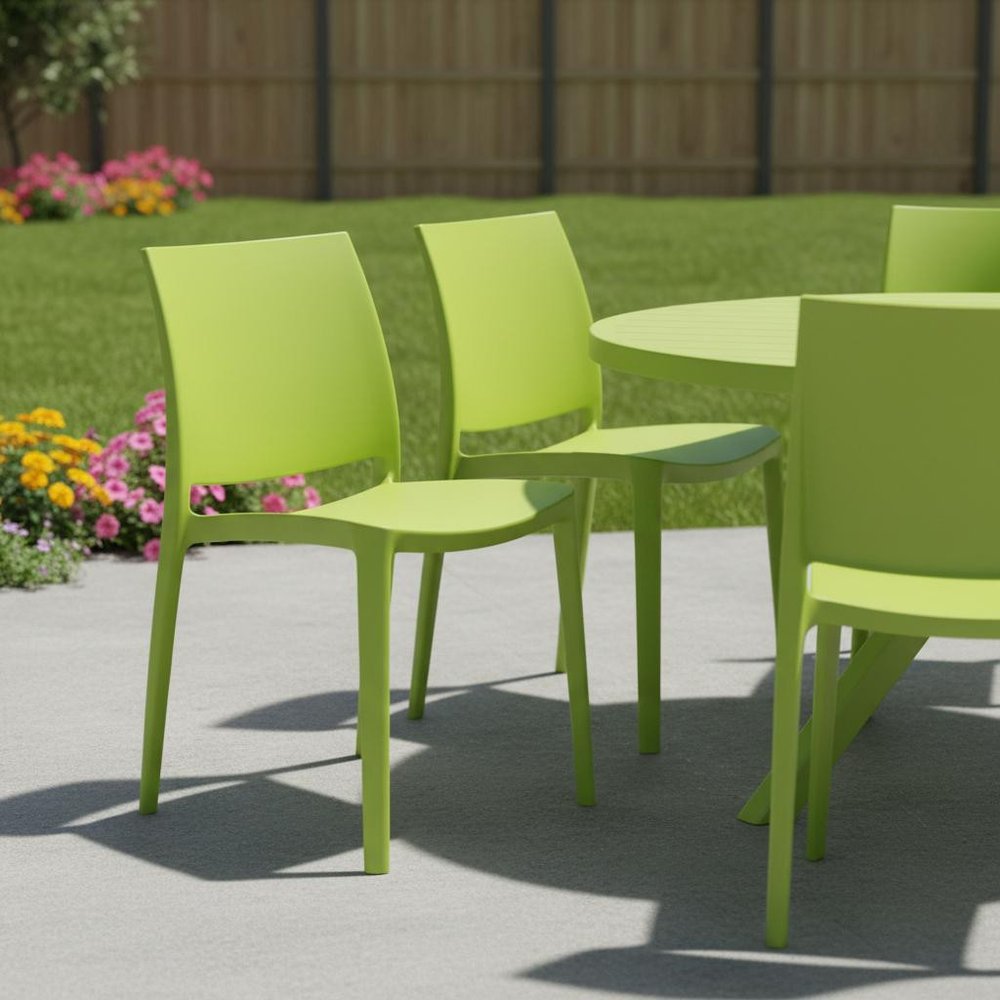 Set of Four Green Heavy Duty Plastic Outdoor Stacking Dining Chairs in a home interior