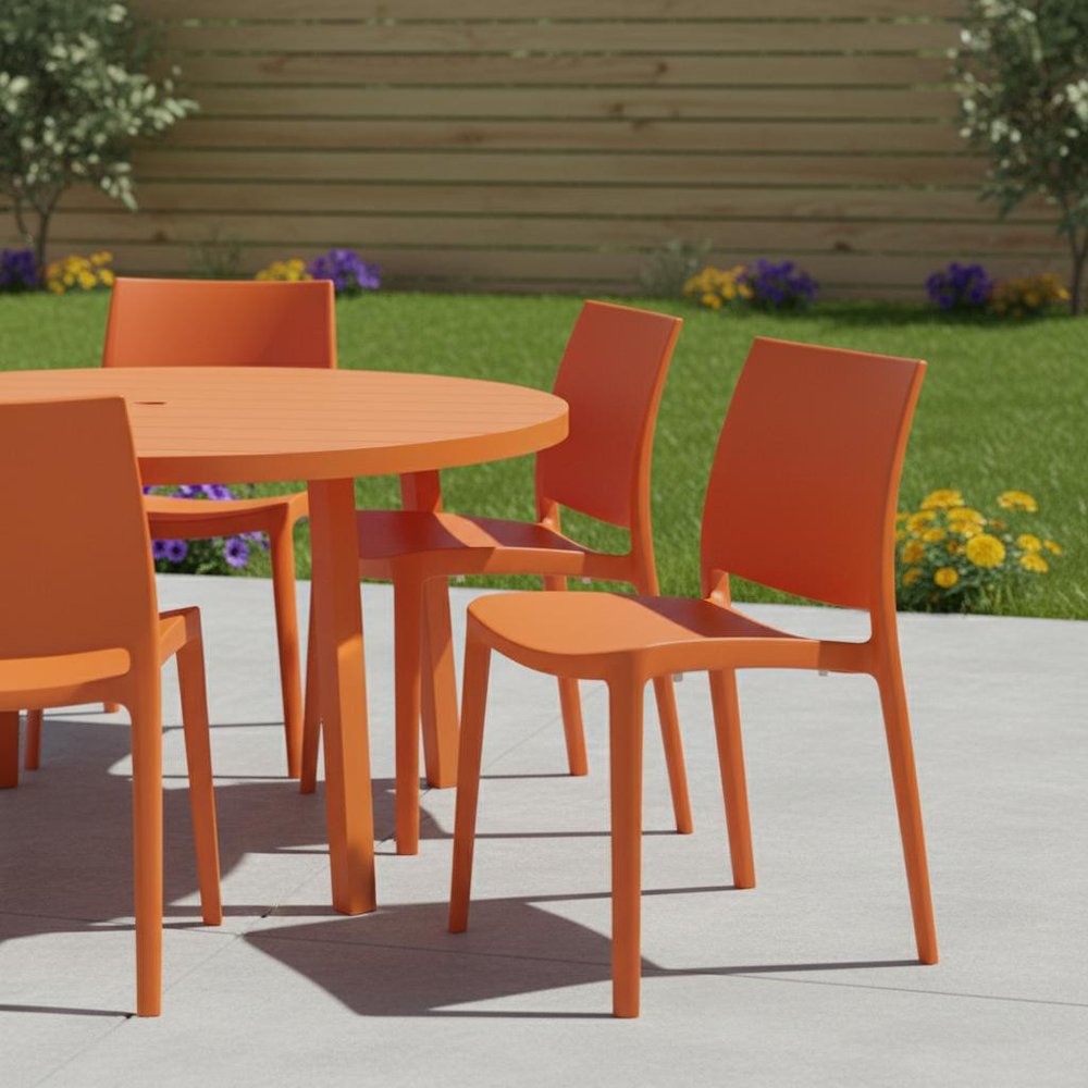 Set of Four Orange Heavy Duty Plastic Outdoor Stacking Dining Chairs in a home interior