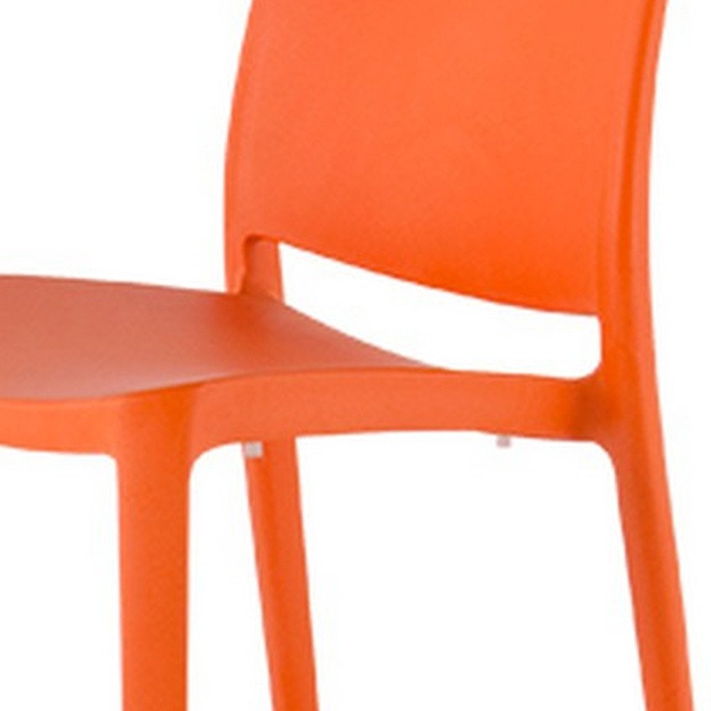 Set of Four Orange Heavy Duty Plastic Outdoor Stacking Dining Chairs on a white background