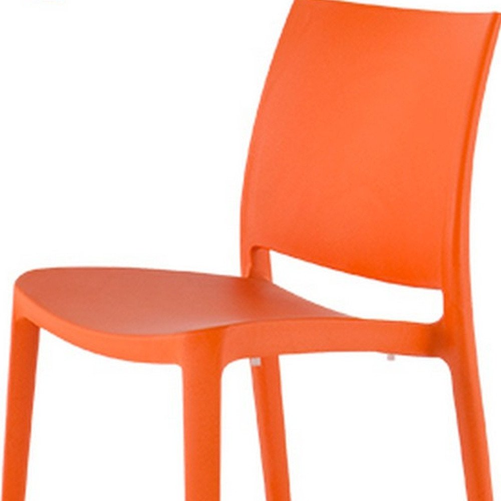 Set of Four Orange Heavy Duty Plastic Outdoor Stacking Dining Chairs on a white background