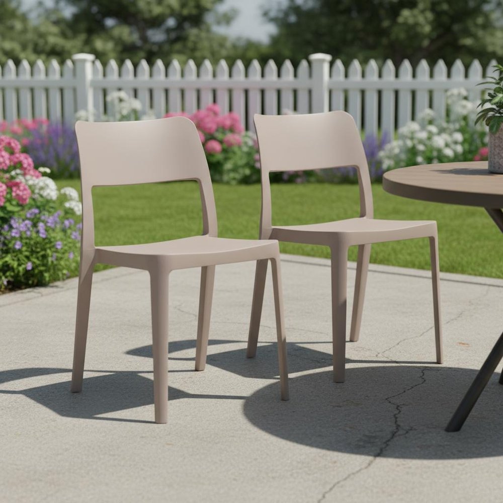 Set of Two Taupe Heavy Duty Plastic Outdoor Stacking Accent Chairs in a home interior