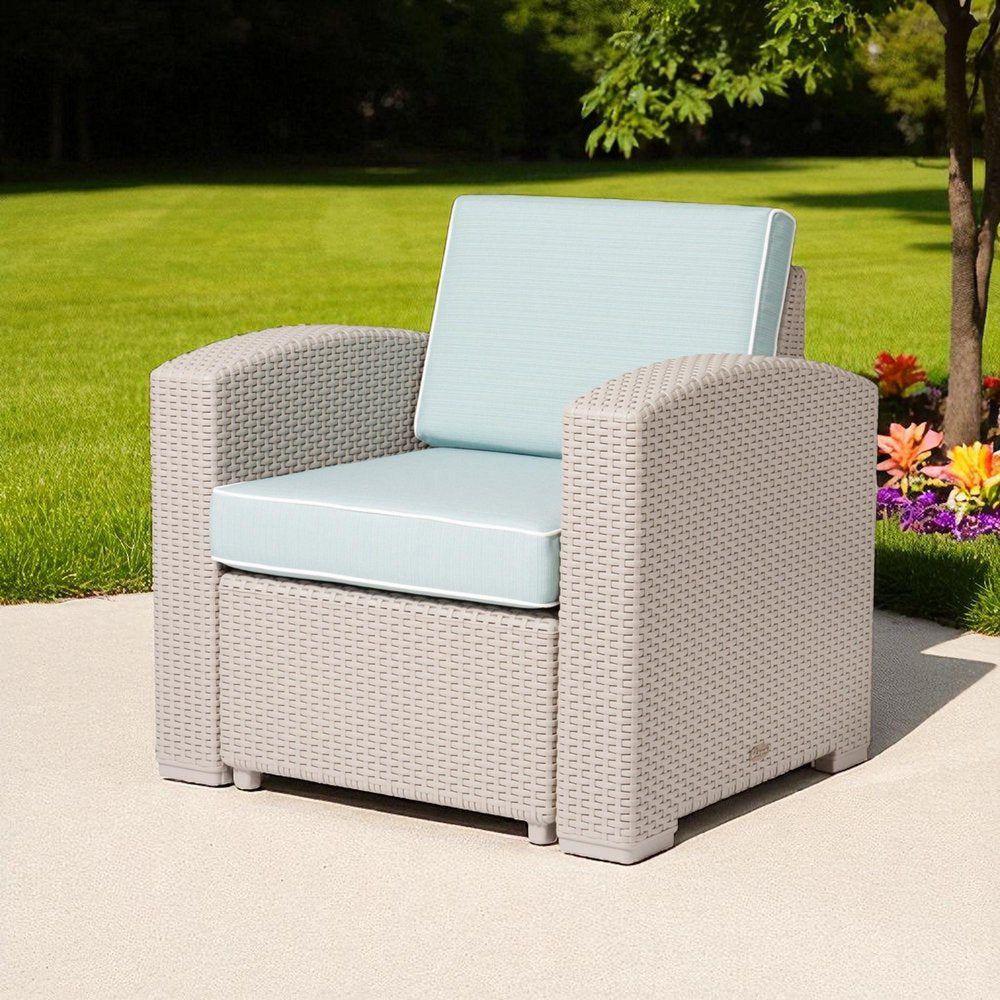 33" Gray Heavy Duty Plastic Outdoor Club Chair With Blue Cushion shown outdoors on a patio.