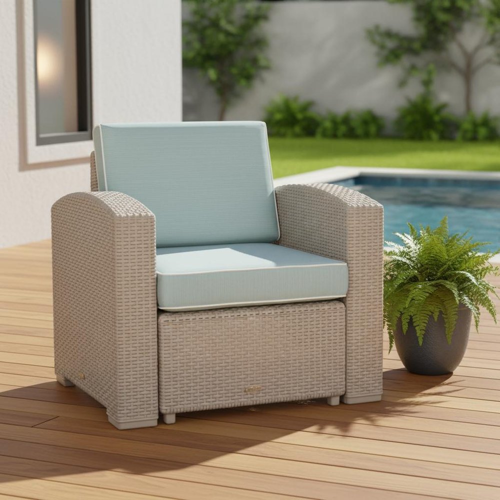 33" Gray Heavy Duty Plastic Outdoor Club Chair With Blue Cushion shown outdoors on a patio with greenery.