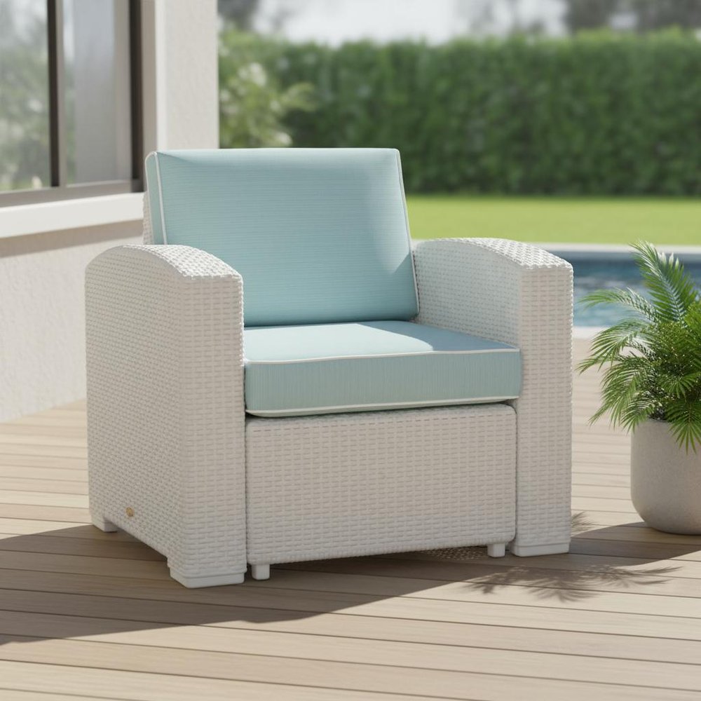 33" White Heavy Duty Plastic Outdoor Club Chair With Aqua Blue Cushion shown outdoors on a tiled patio with greenery.