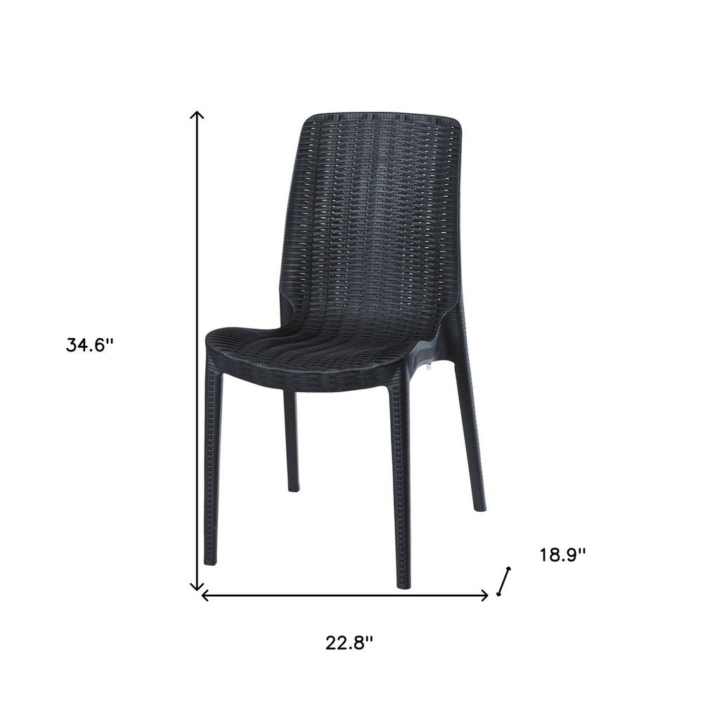 Set of Four Black Heavy Duty Plastic Outdoor Stacking Dining Chairs on a white background