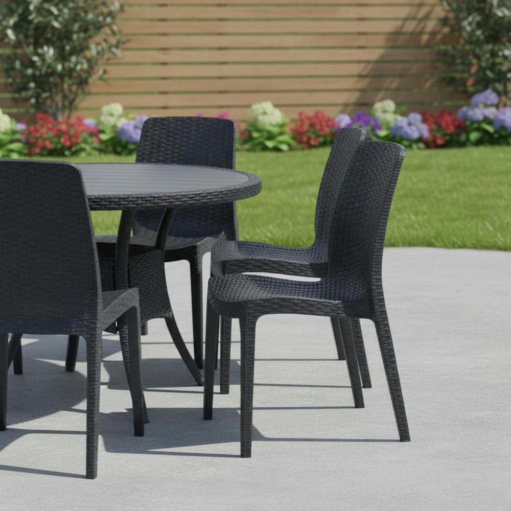 Set of Four Black Heavy Duty Plastic Outdoor Stacking Dining Chairs in a home interior