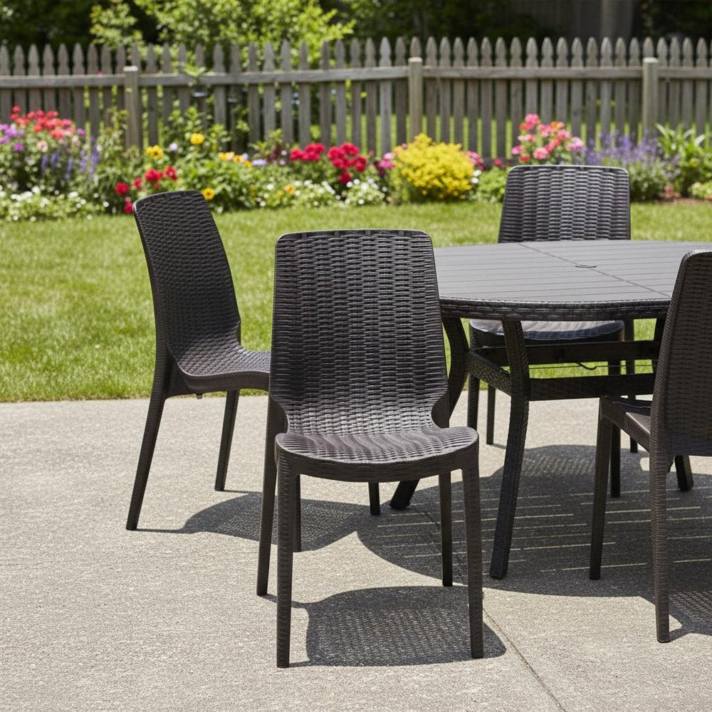 Set of Four Brown Heavy Duty Plastic Outdoor Stacking Dining Chairs in a home interior