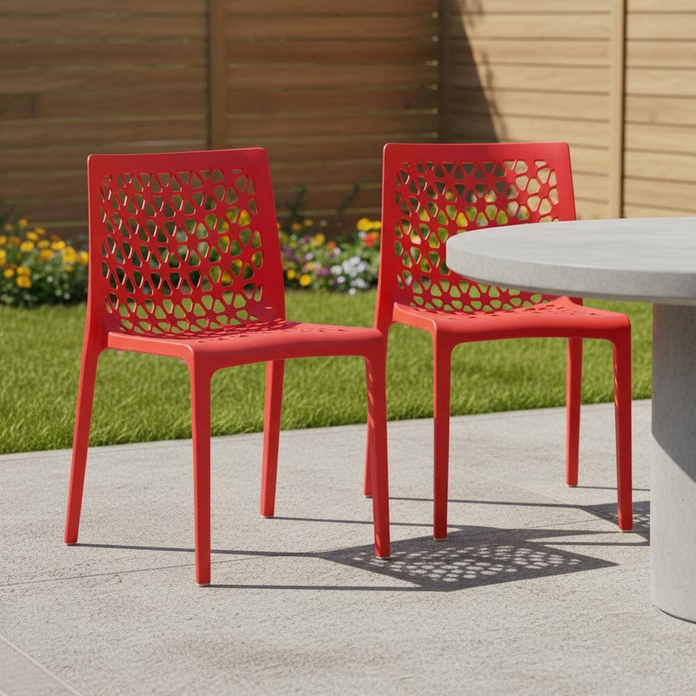 Set of Two Red Heavy Duty Plastic Outdoor Stacking Dining Chairs in a home interior