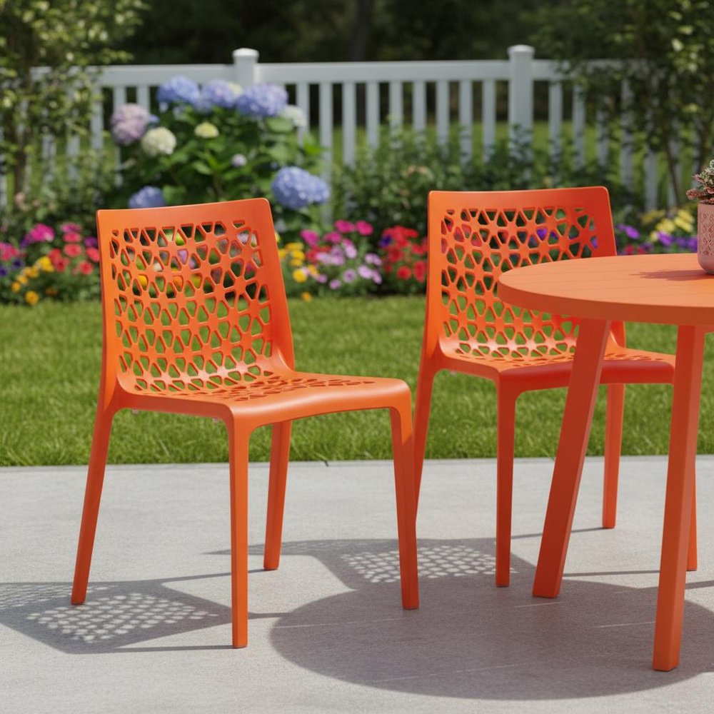 Set of Two Orange Heavy Duty Plastic Outdoor Stacking Dining Chairs in a home interior