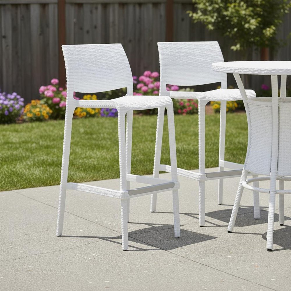 Set of Two 30" White Faux Rattan Low Back Outdoor Bar Height Chairs in a home interior