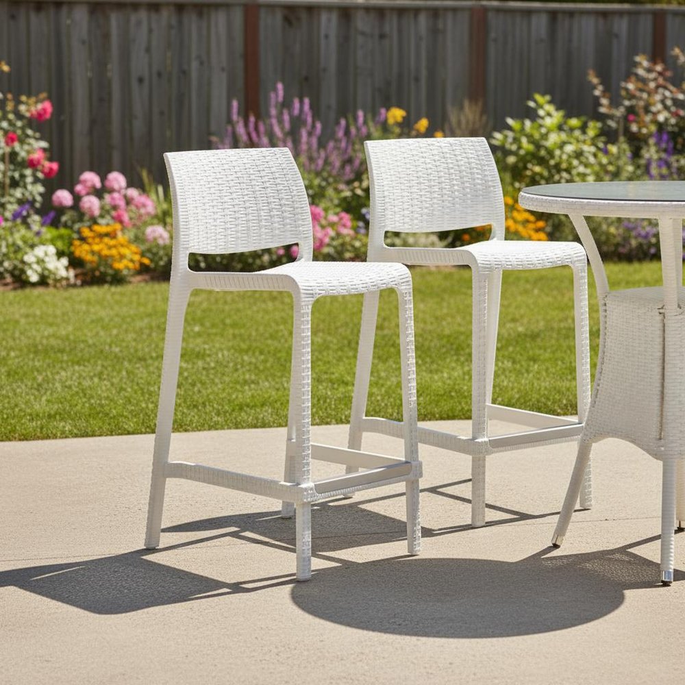 Set of Two 26" White Faux Rattan Low Back Outdoor Counter Height Bar Chairs in a home interior