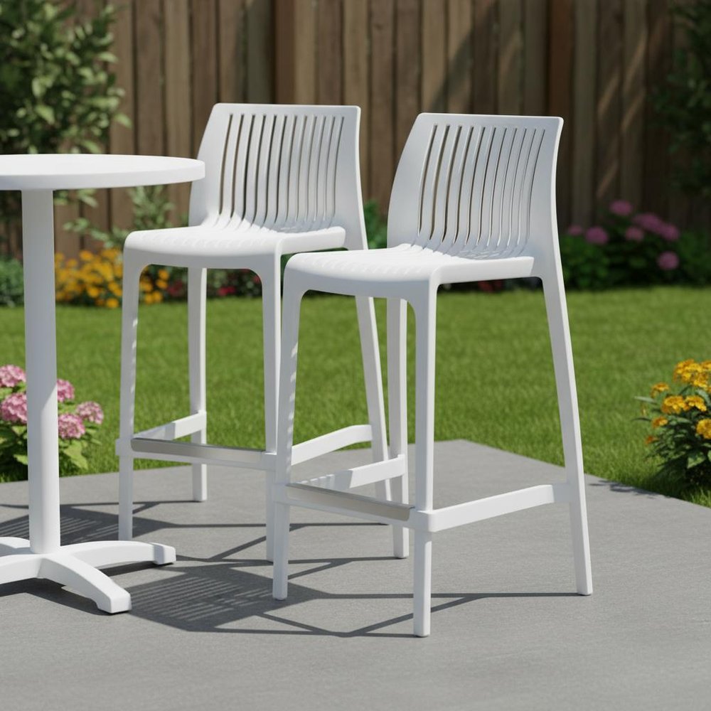Set of Two 26" White Heavy Duty Plastic Low Back Outdoor Counter Height Bar Chairs in a home interior