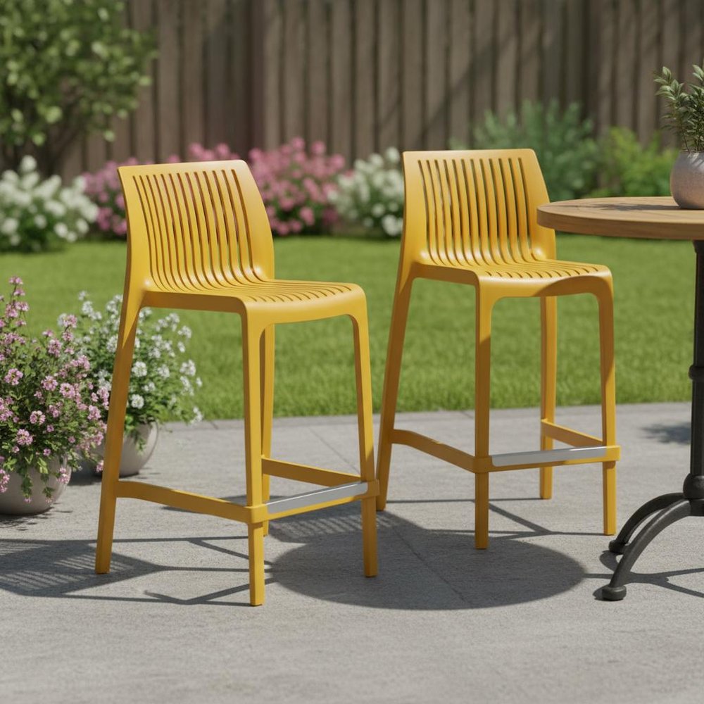 Set of Two 26" Yellow Heavy Duty Plastic Low Back Outdoor Counter Height Bar Chairs in a home interior