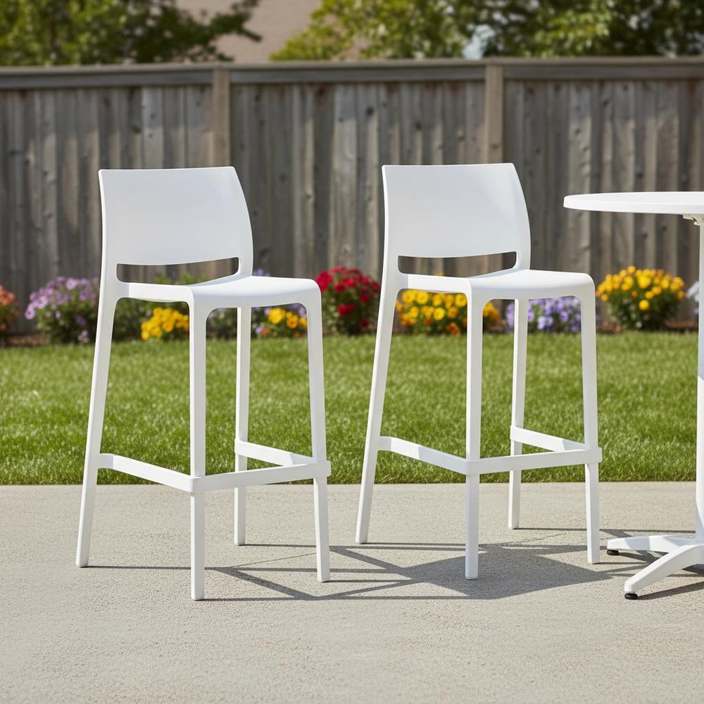 Set of Two 30" White Heavy Duty Plastic Low Back Outdoor Bar Height Chairs in a home interior