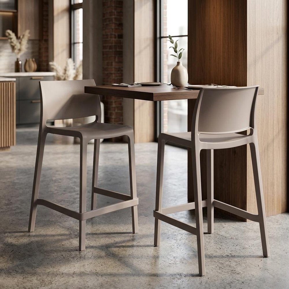 Set of Two 26" Taupe Heavy Duty Plastic Low Back Outdoor Counter Height Bar Chairs in a home interior