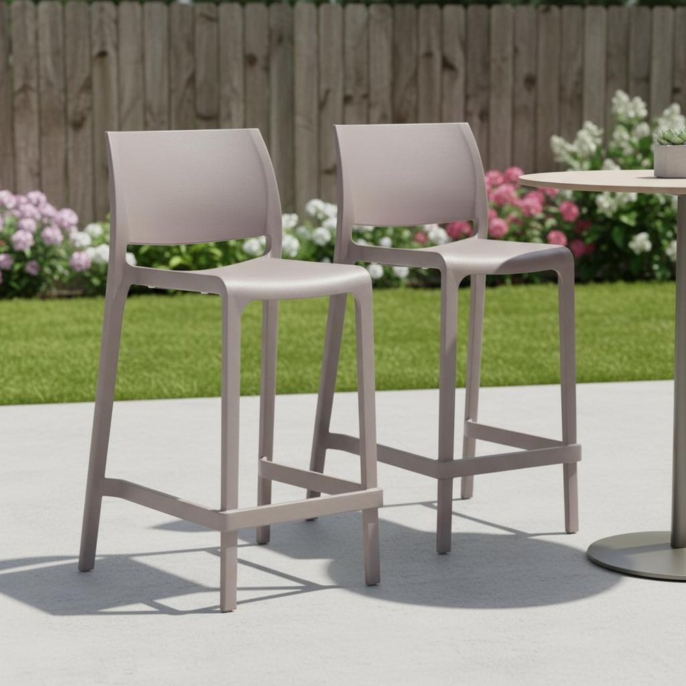Set of Two 26" Taupe Heavy Duty Plastic Low Back Outdoor Counter Height Bar Chairs in a home interior