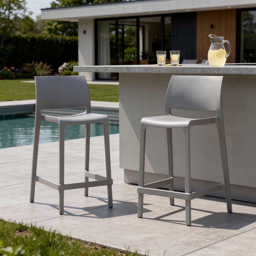 Set of Two 26" Gray Heavy Duty Plastic Low Back Outdoor Counter Height Bar Chairs in a home interior