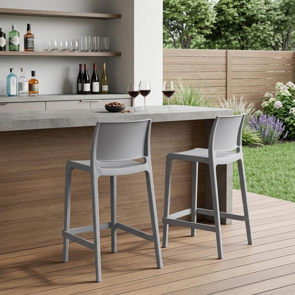 Set of Two 26" Gray Heavy Duty Plastic Low Back Outdoor Counter Height Bar Chairs in a home interior