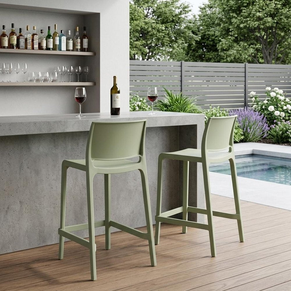 Set of Two 26" Green Heavy Duty Plastic Low Back Outdoor Counter Height Bar Chairs in a home interior