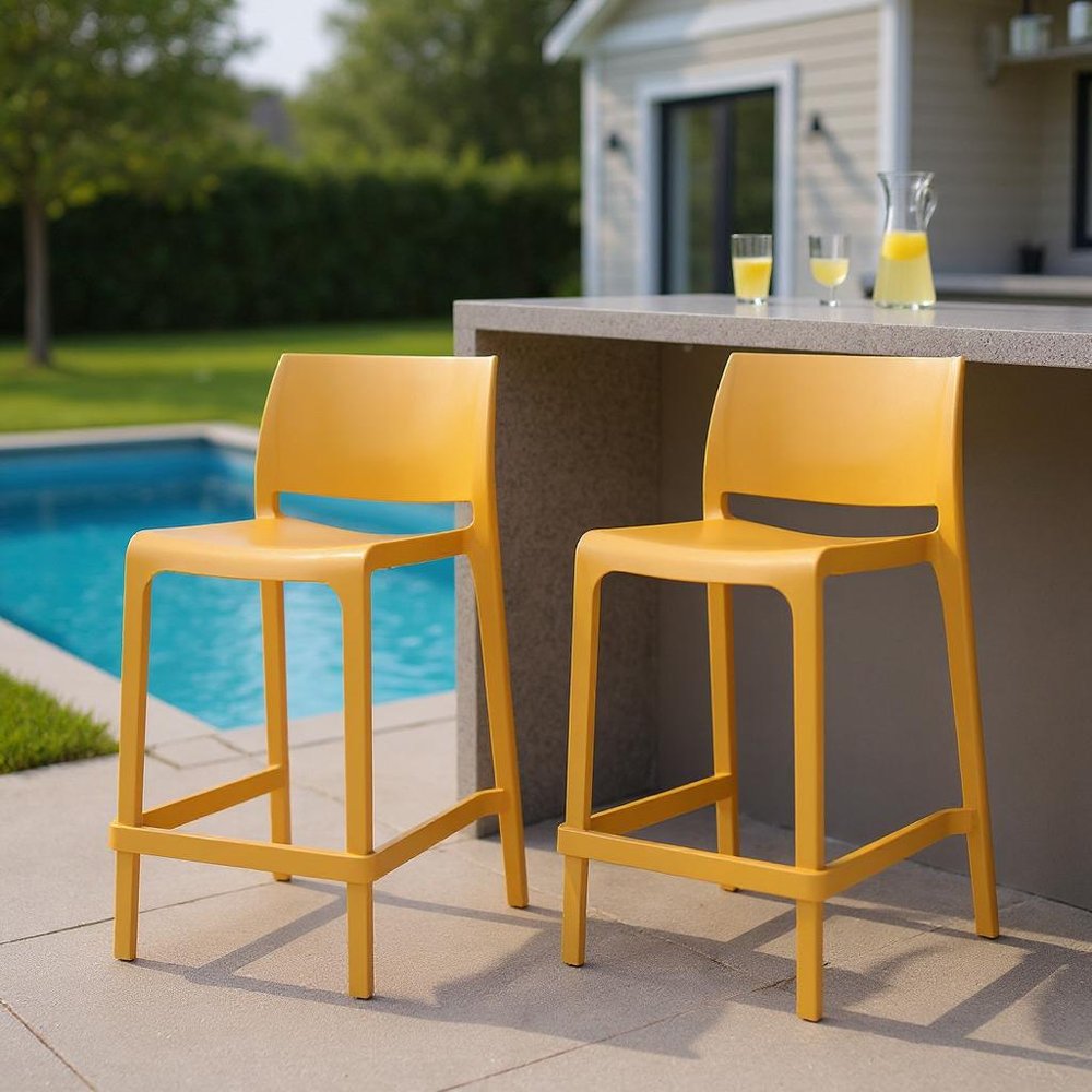 Set of Two 26" Gold and Yellow Heavy Duty Plastic Low Back Outdoor Counter Height Bar Chairs in a home interior