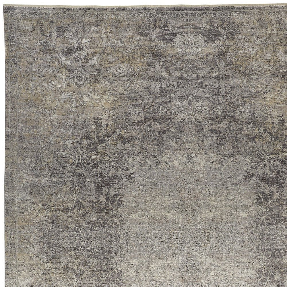 9' X 13' Tan and Gray Oriental Power Loom Worn Faded Area Rug close-up detail