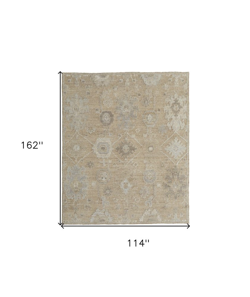 9' X 13' Tan and Ivory Wool Floral Hand Knotted Area Rug on a white background