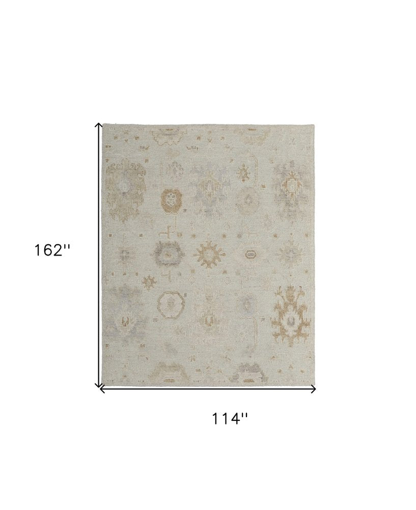 9' X 13' Tan and Gray Wool Floral Hand Knotted Area Rug on a white background