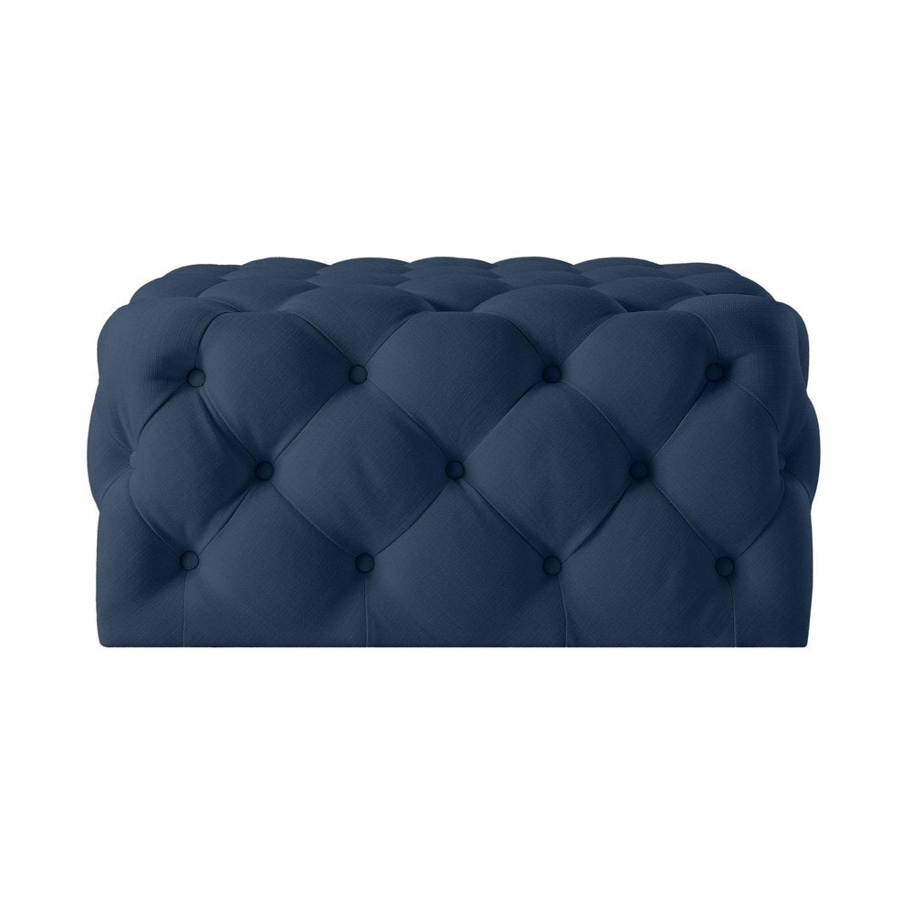 33" Navy Blue Velvet Rolling Tufted Cocktail Ottoman. Ottoman isolated on a plain white background, in a navy velvet finish.