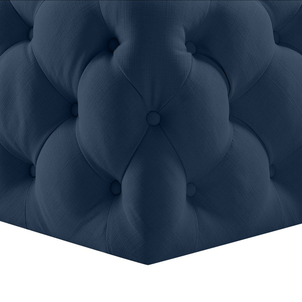 33" Navy Blue Velvet Rolling Tufted Cocktail Ottoman. Ottoman in navy velvet.