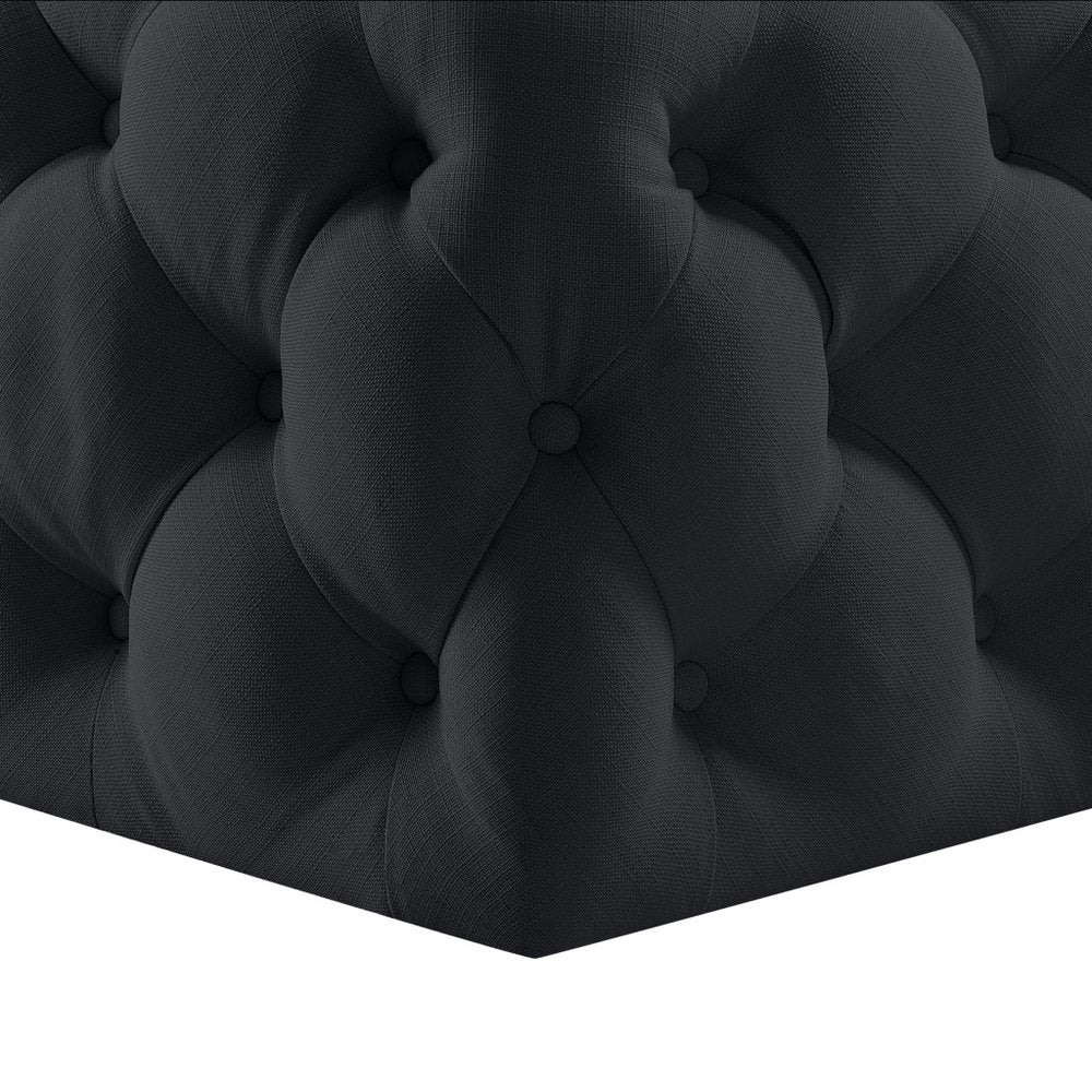 33" Navy Blue Velvet Rolling Tufted Cocktail Ottoman photographed against a dark studio background in navy.