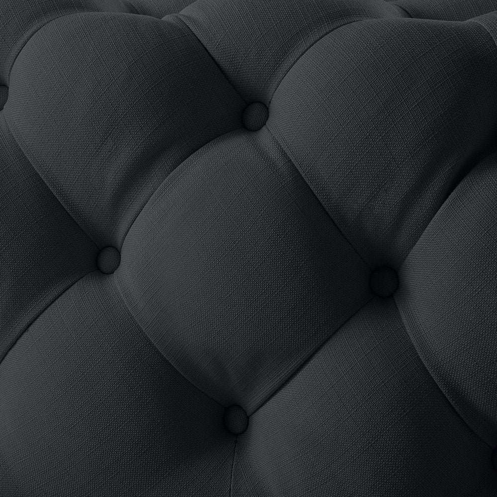 33" Navy Blue Velvet Rolling Tufted Cocktail Ottoman photographed against a dark studio background in navy.