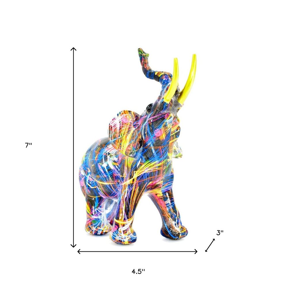 7" Blue Yellow And Pink Resin Elephant Tabletop Sculpture on a white background