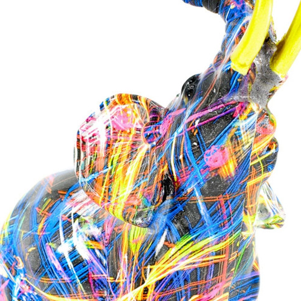 7" Blue Yellow And Pink Resin Elephant Tabletop Sculpture on a white background