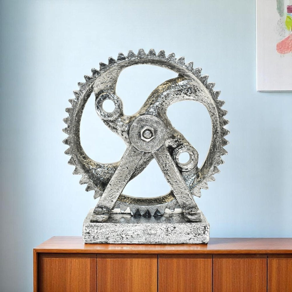 5" Pewter Resin Tabletop Sculpture shown outdoors on an outdoor setting in blue resin.