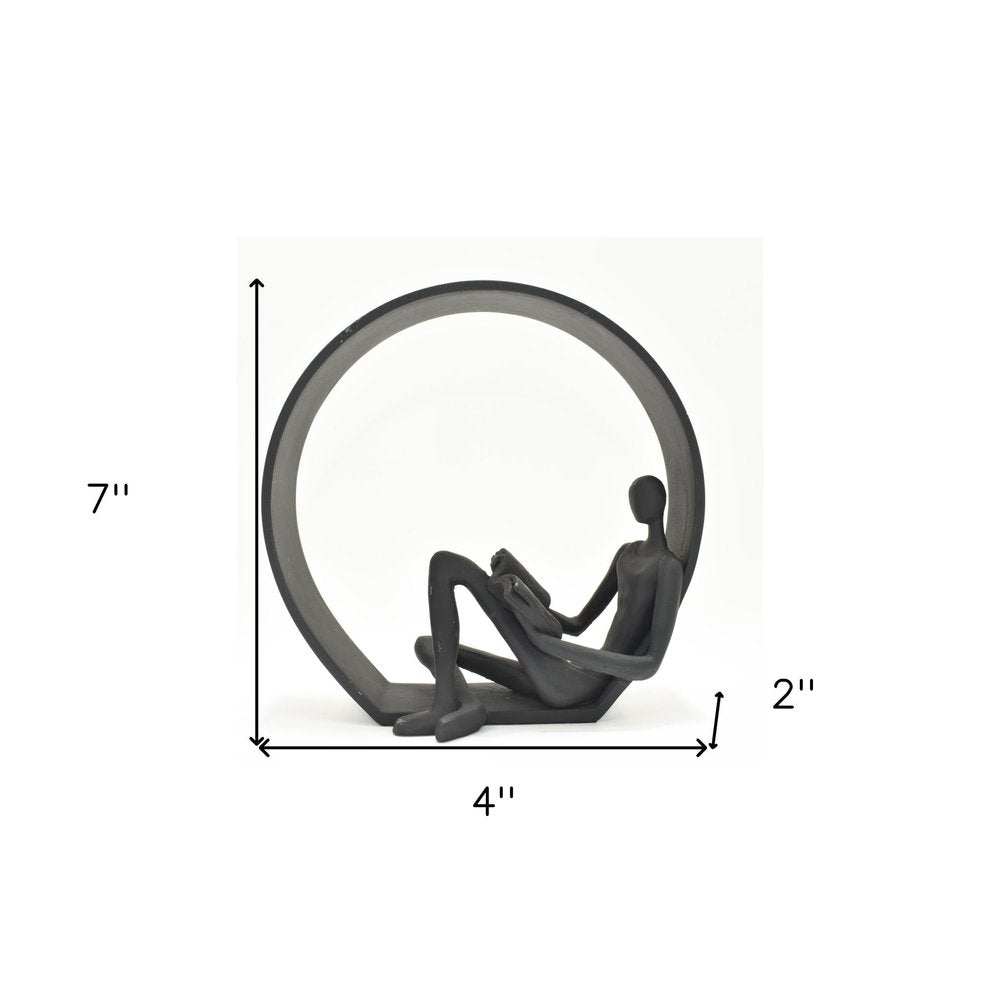 7" Black Resin Man Tabletop Sculpture on a white background
