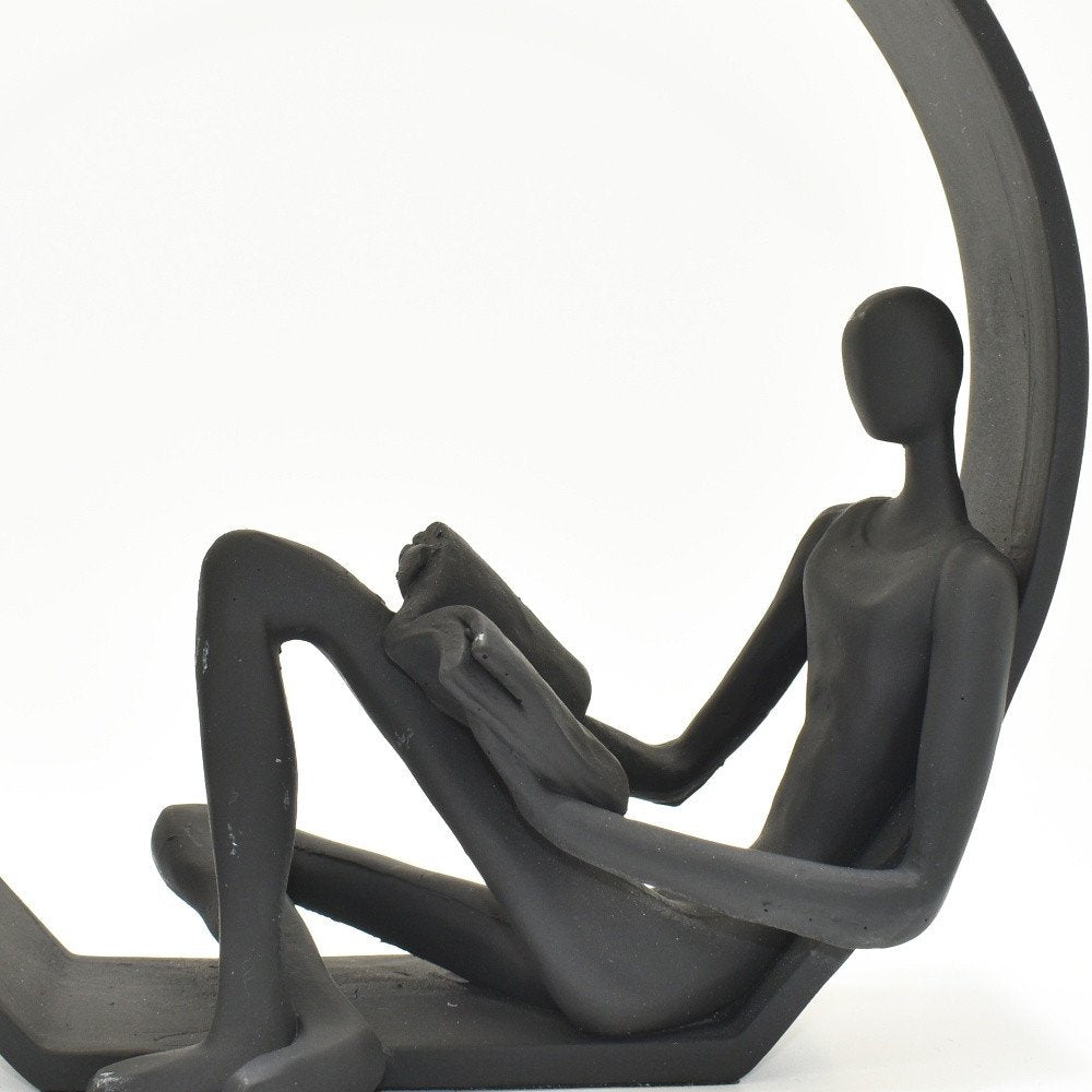 7" Black Resin Man Tabletop Sculpture on a white background