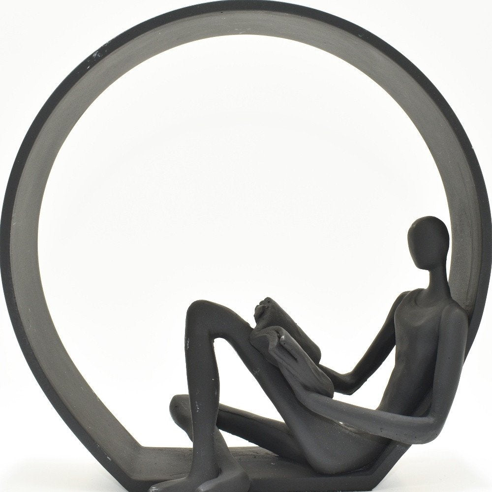 7" Black Resin Man Tabletop Sculpture on a white background
