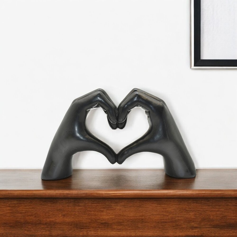 4" Black Resin Heart Hands Tabletop Sculpture. Sculpture isolated on a plain white background, finished in black resin.