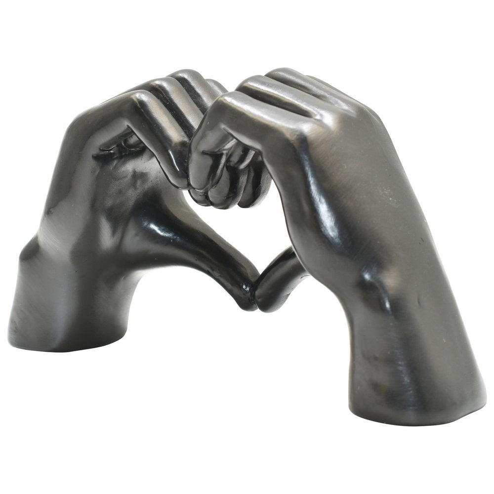 4" Black Resin Heart Hands Tabletop Sculpture. Sculpture isolated on a plain white background, showing a black resin surface.