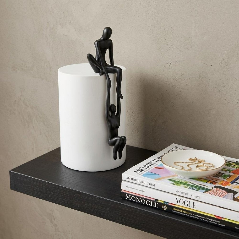 8" Black Resin People Tabletop Sculpture in a home interior