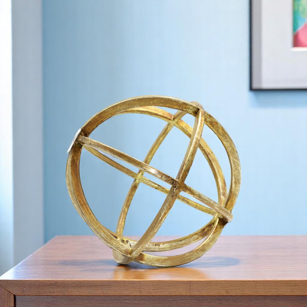 6" Antiqued Gold Metal Tabletop Sculpture shown outdoors on an outdoor setting.