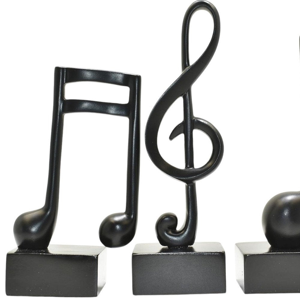 Set of Three Black Resin Music Tabletop Sculpture on a white background