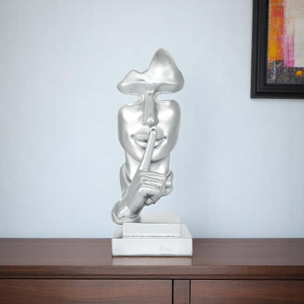 6" Silver Resin Tabletop Sculpture shown outdoors on an outdoor setting.
