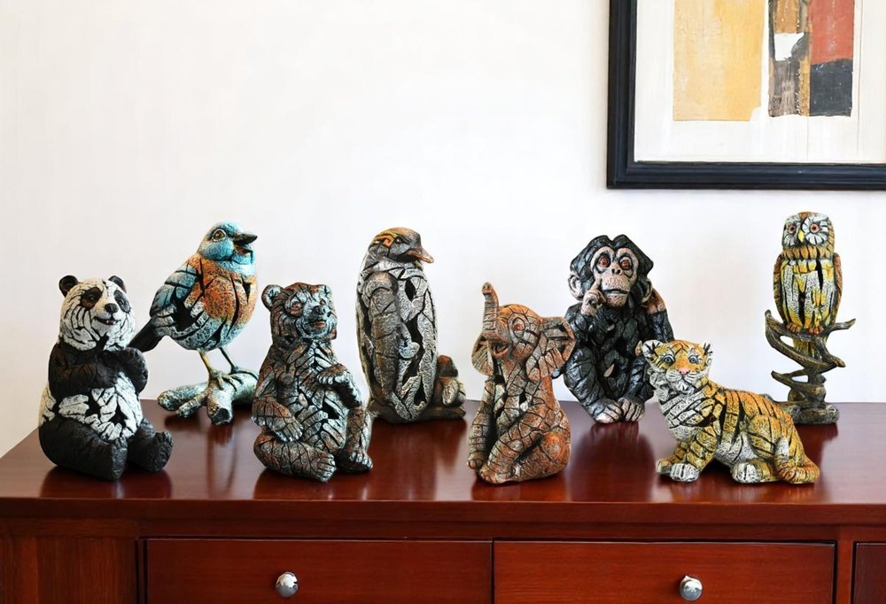 Set of Eight Brown White And Black Resin Panda, Bird, Bear, Monkey, Penguin, Elephant, Tiger, Owl Tabletop Sculpture