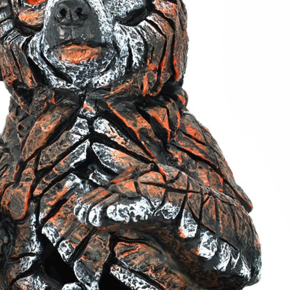 6" Brown White And Black Resin Bear Tabletop Sculpture. Sculpture in black resin.