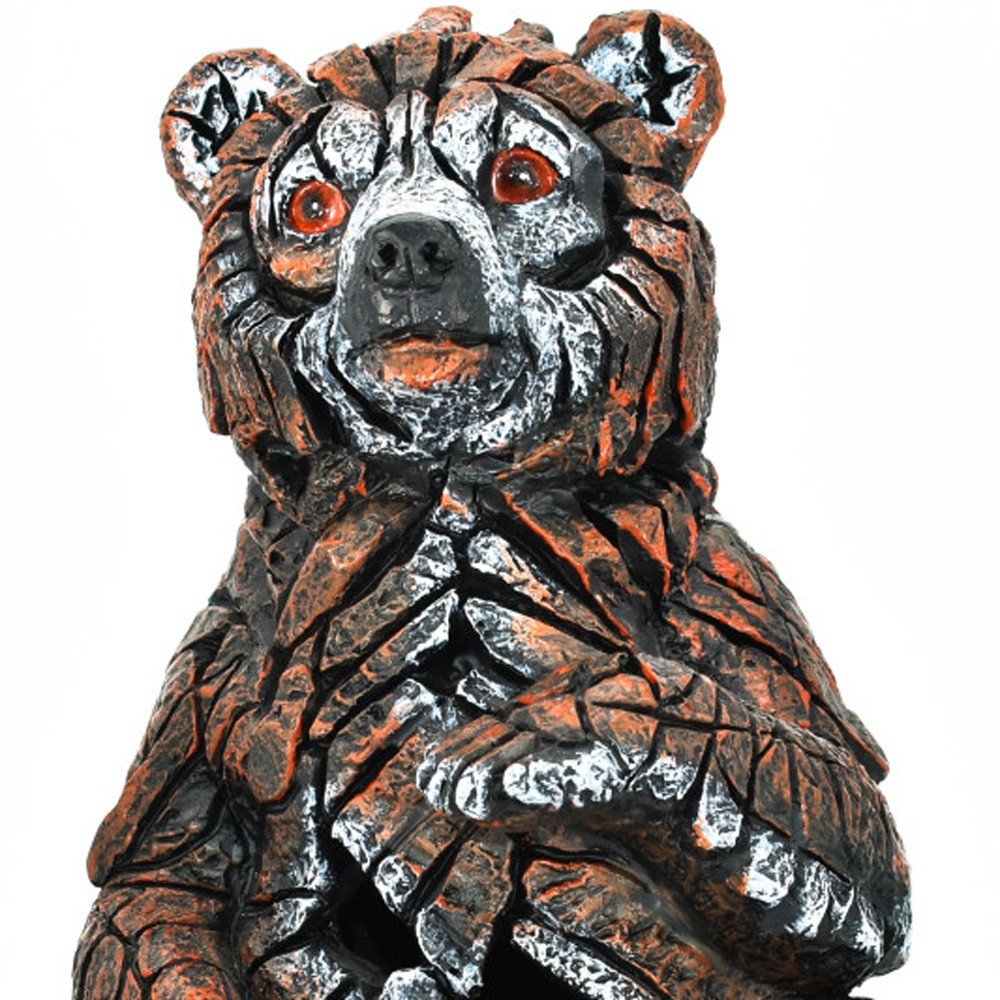 6" Brown White And Black Resin Bear Tabletop Sculpture. Sculpture isolated on a plain white background, finished in black resin.