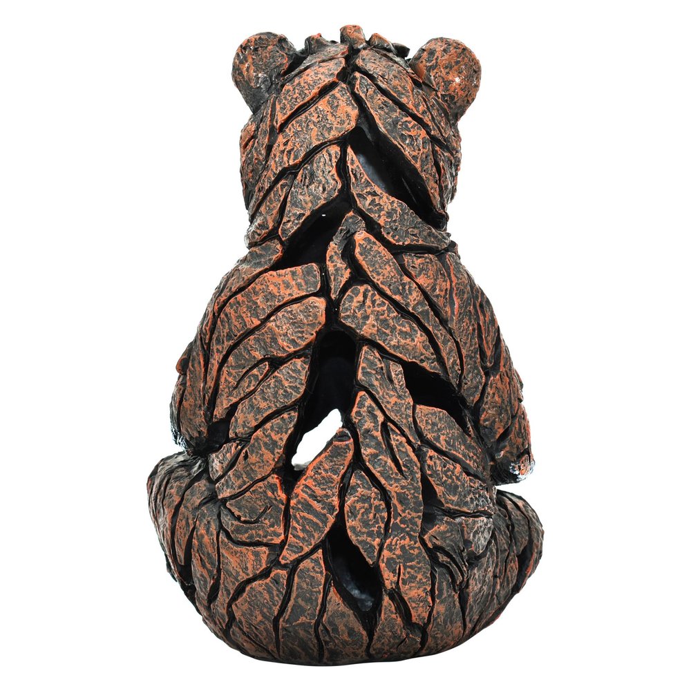 6" Brown White And Black Resin Bear Tabletop Sculpture. Sculpture isolated on a plain white background, finished in black resin.
