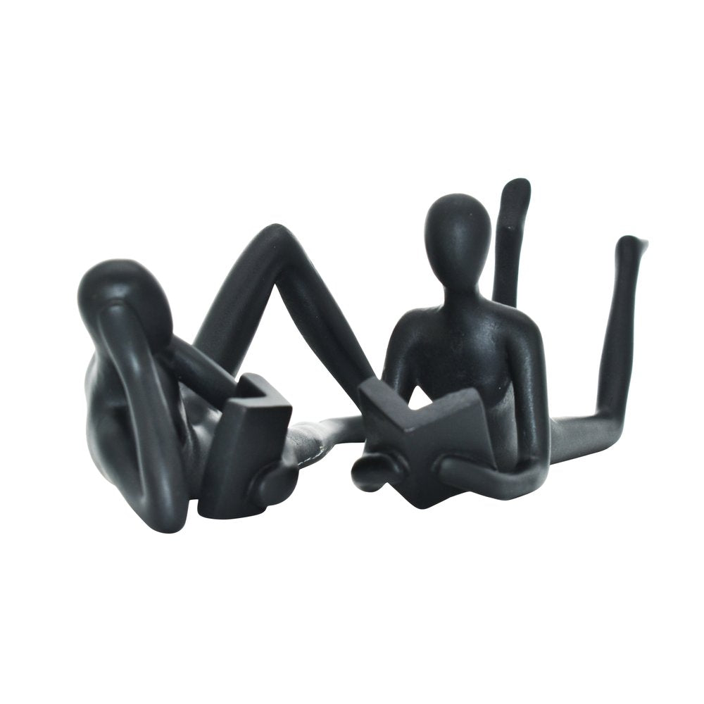 Set of Two Black Resin People Tabletop Sculpture on a white background