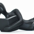 Set of Two Black Resin People Tabletop Sculpture on a white background